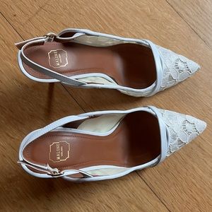 White lace slingback shoe.